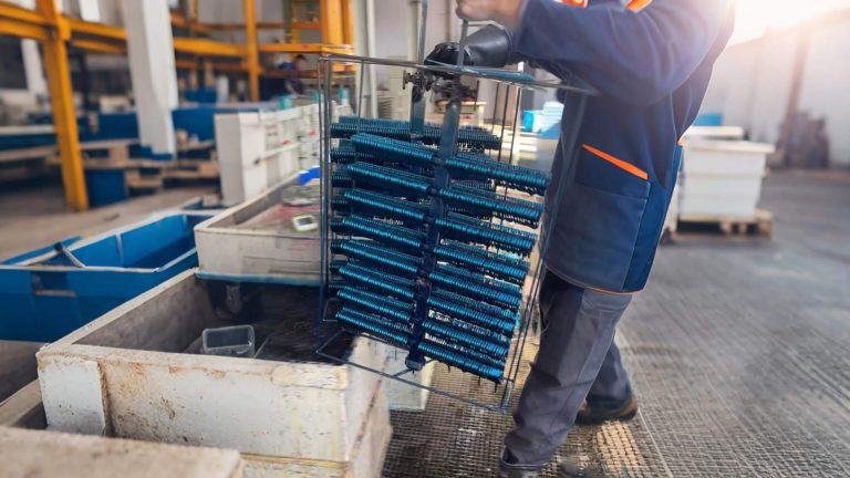 alt="Step 5: anodizing and coloring process to enhance the durability and appearance of our carabiner keychain"
